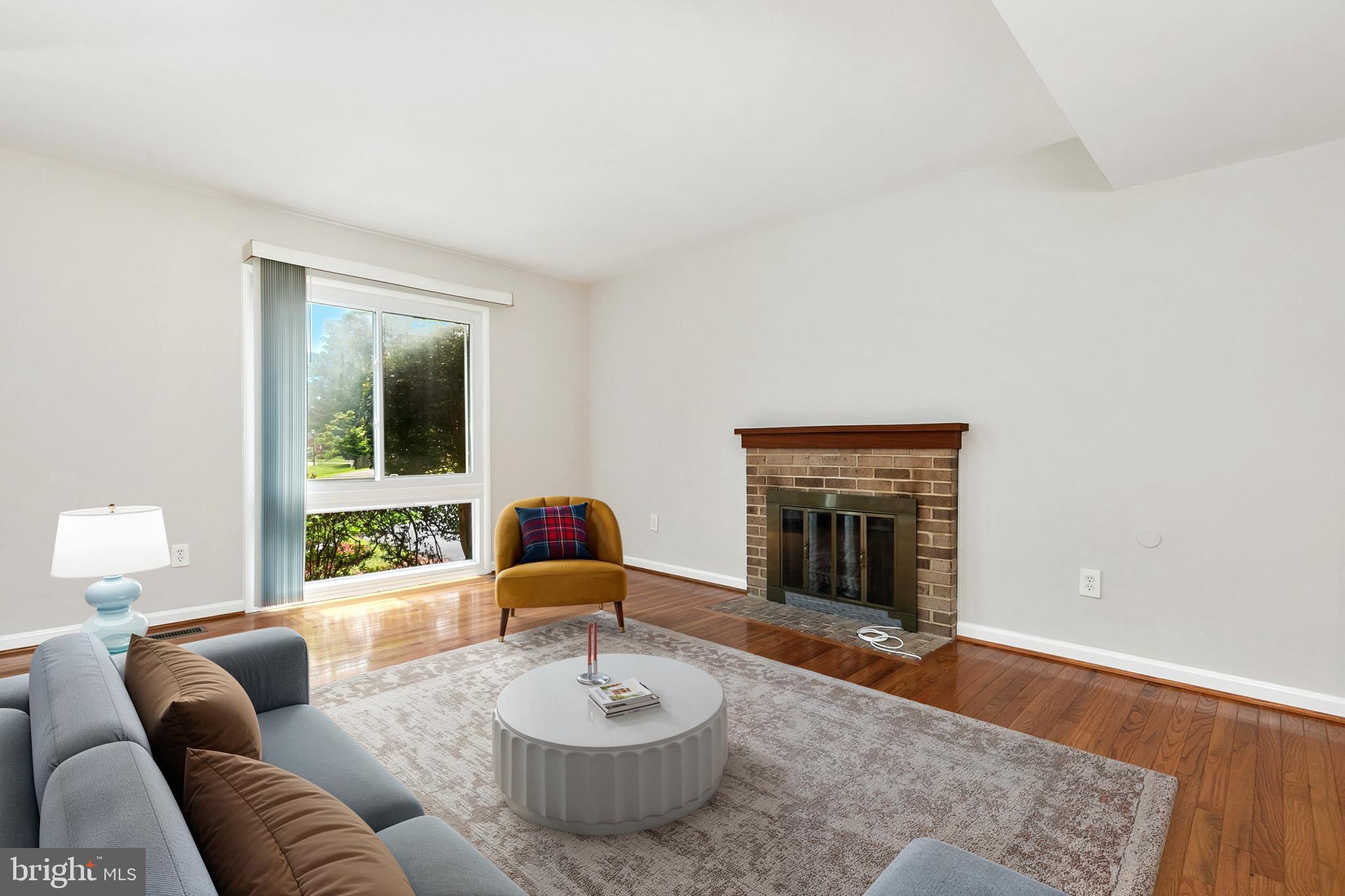 11501 Piney Lodge Road North Potomac, MD 20878 - Photo 58 of 64 a living room with furniture and a fireplace