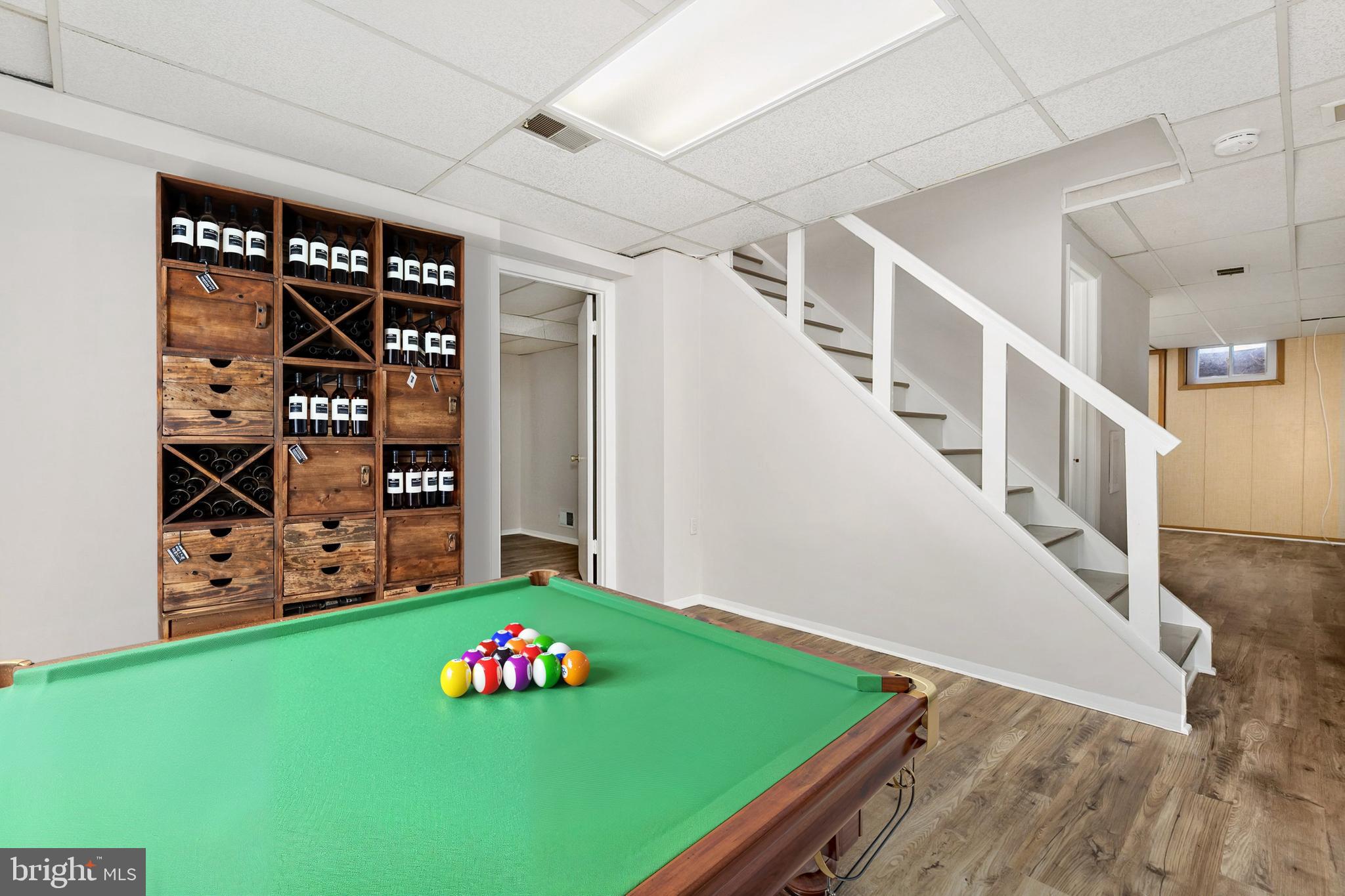 11501 Piney Lodge Road North Potomac, MD 20878 - Photo 62 of 64 a view of an empty room with wooden floor and cabinet