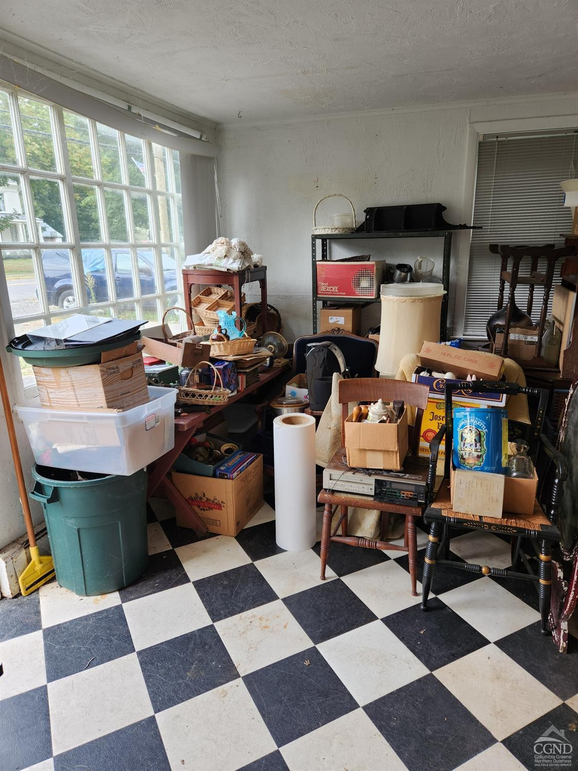 190 County Route Copake, NY 12516 - Photo 9 of 20 a living room with a black white checkered floor with a gaming machine and appliances