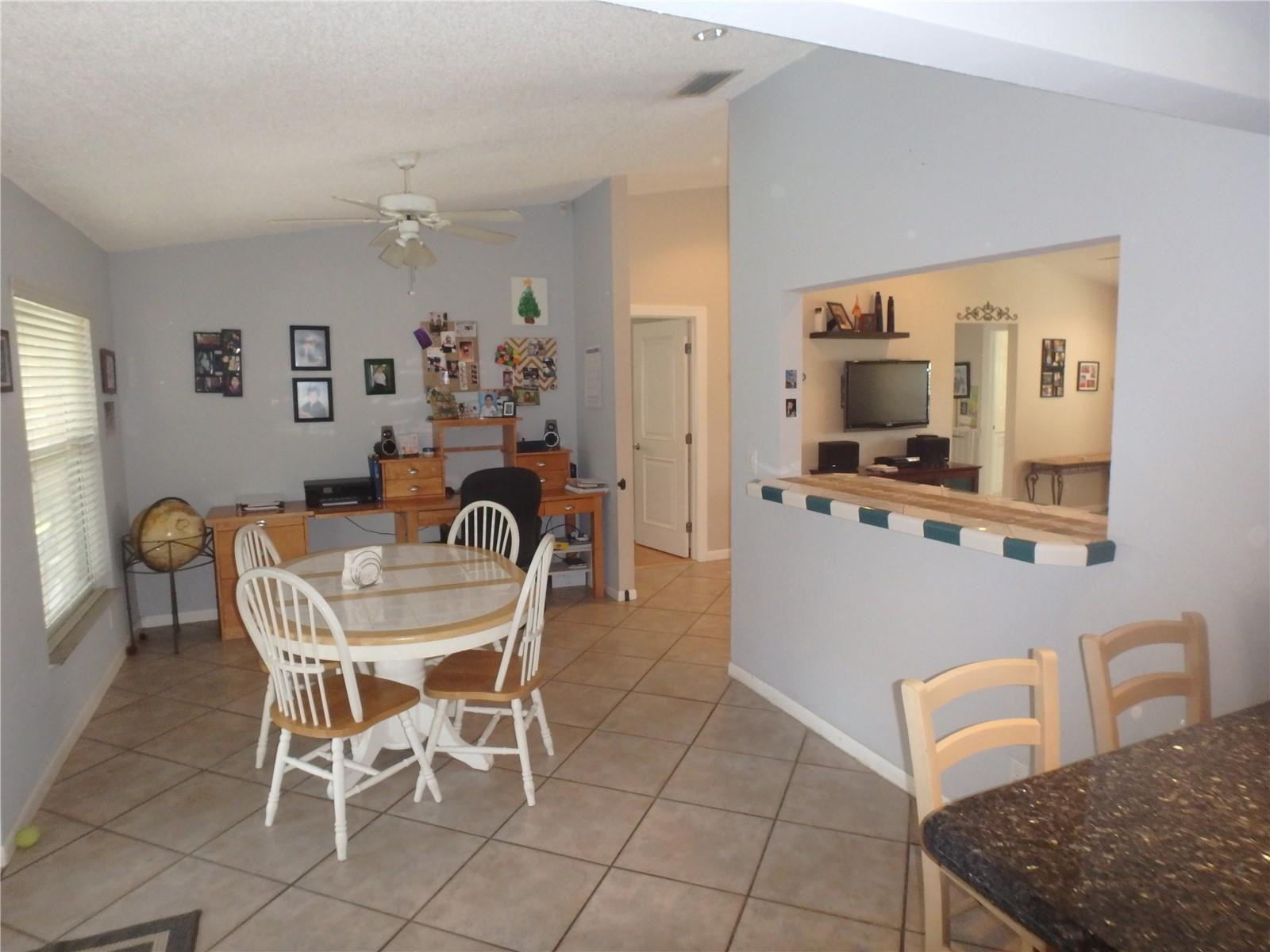 9291 Southwest 18th Road Boca Raton, FL 33428 - Photo 5 of 20 a dining room with furniture and window