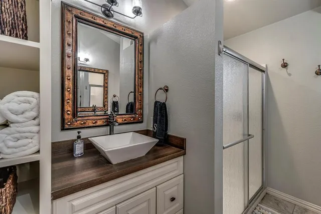 a bathroom with a sink and a mirror