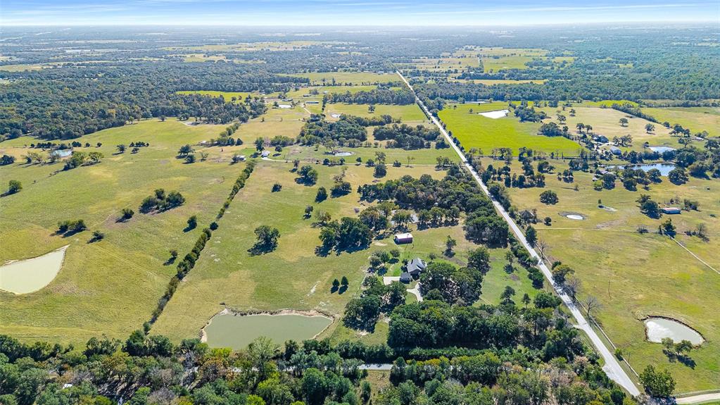 11631 Hiram Road Wills Point, TX 75169 - Photo 11 of 31 an aerial view of ocean with residential building and ocean view