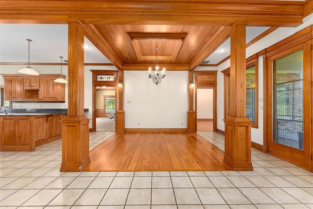 11631 Hiram Road Wills Point, TX 75169 - Photo 17 of 31 a view of empty room with wooden floor and windows