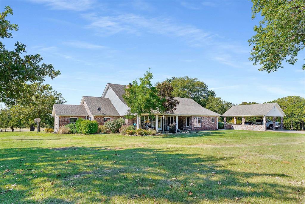11631 Hiram Road Wills Point, TX 75169 - Photo 5 of 31 a front view of a house with a yard