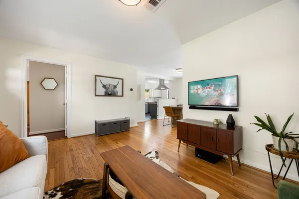 a living room with furniture and a flat screen tv