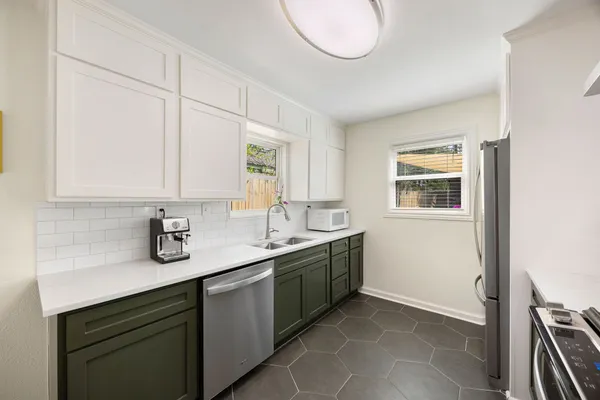 a kitchen with a sink and a stove