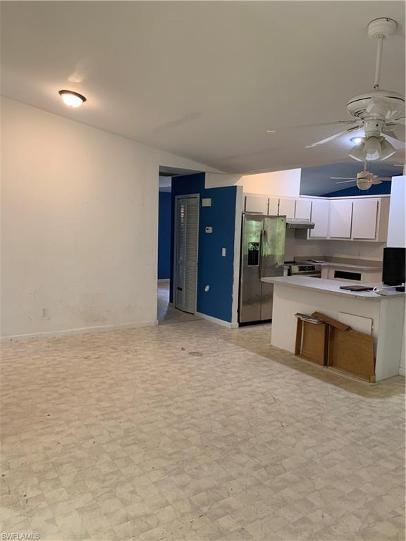 540 2nd Street Southeast Naples, FL 34117 - Photo 11 of 27 a kitchen with stainless steel appliances a refrigerator and a stove top oven