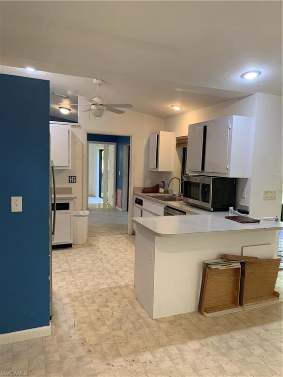 540 2nd Street Southeast Naples, FL 34117 - Photo 12 of 27 a large kitchen with a large counter top appliances and cabinets