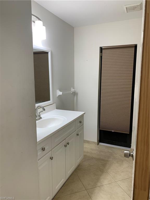 540 2nd Street Southeast Naples, FL 34117 - Photo 14 of 27 a bathroom with a sink and a mirror