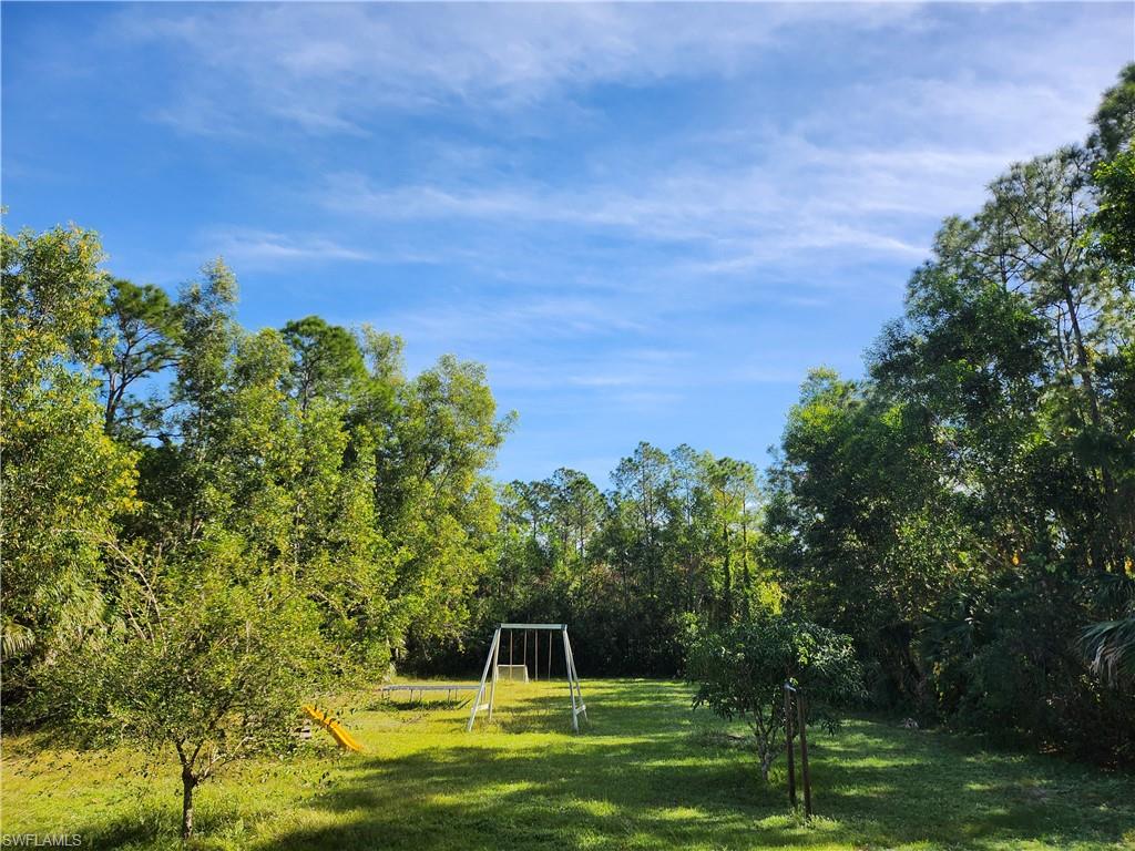 540 2nd Street Southeast Naples, FL 34117 - Photo 3 of 27 a view of a yard with a house