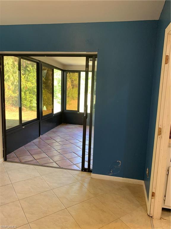 540 2nd Street Southeast Naples, FL 34117 - Photo 6 of 27 a view of an empty room and window