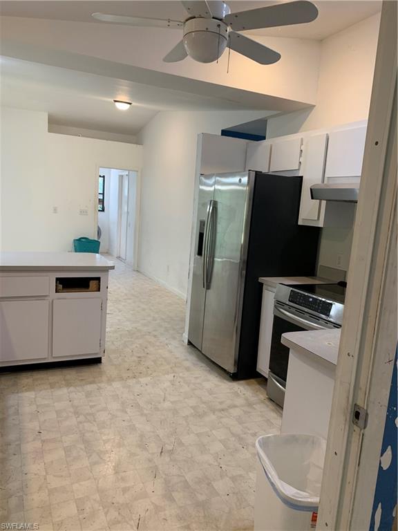 540 2nd Street Southeast Naples, FL 34117 - Photo 8 of 27 a kitchen with stainless steel appliances a refrigerator and a stove