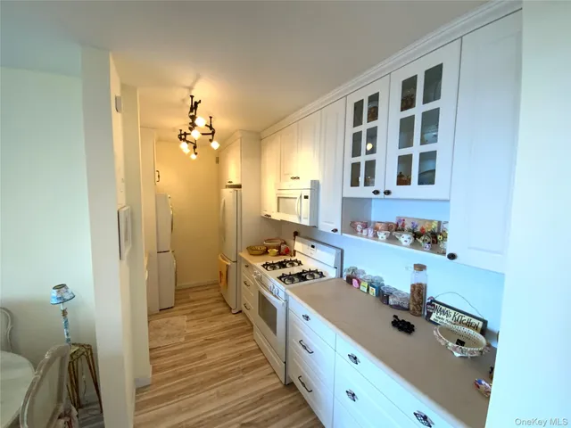 a kitchen with a refrigerator and a stove