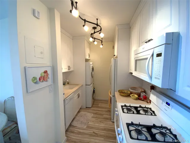 a kitchen with a refrigerator and a stove