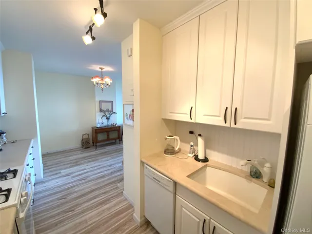 a kitchen with a sink and a window