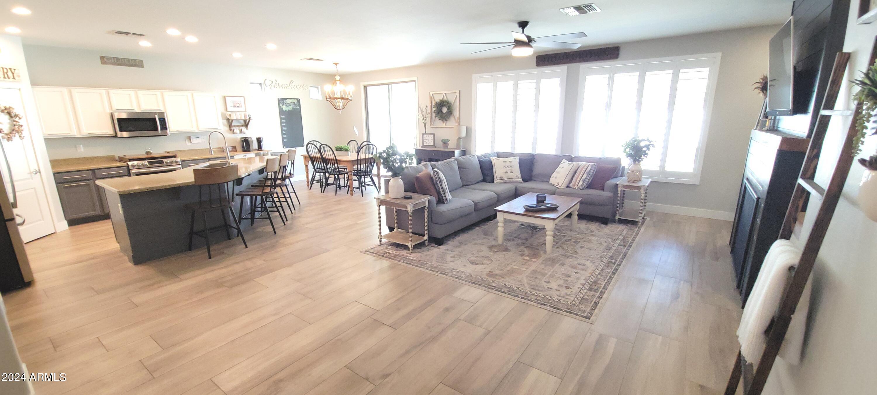 3236 East Phelps Street Gilbert, AZ 85295 - Photo 11 of 50 a living room with lots of furniture and a large window