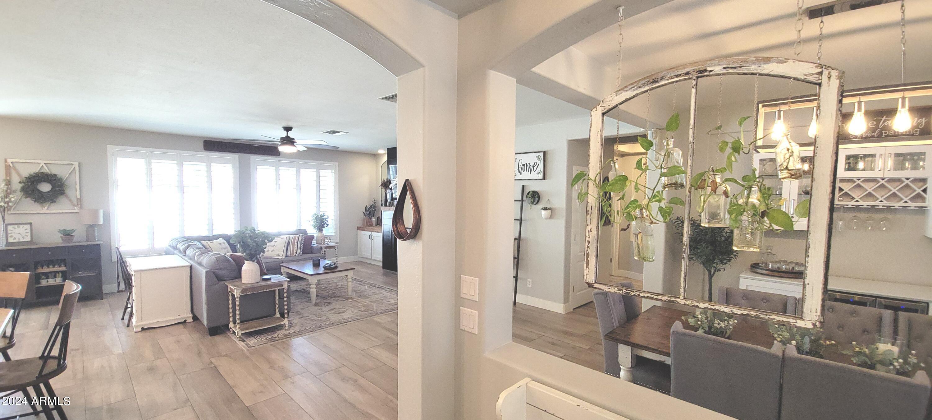3236 East Phelps Street Gilbert, AZ 85295 - Photo 15 of 50 a living room with furniture and large windows