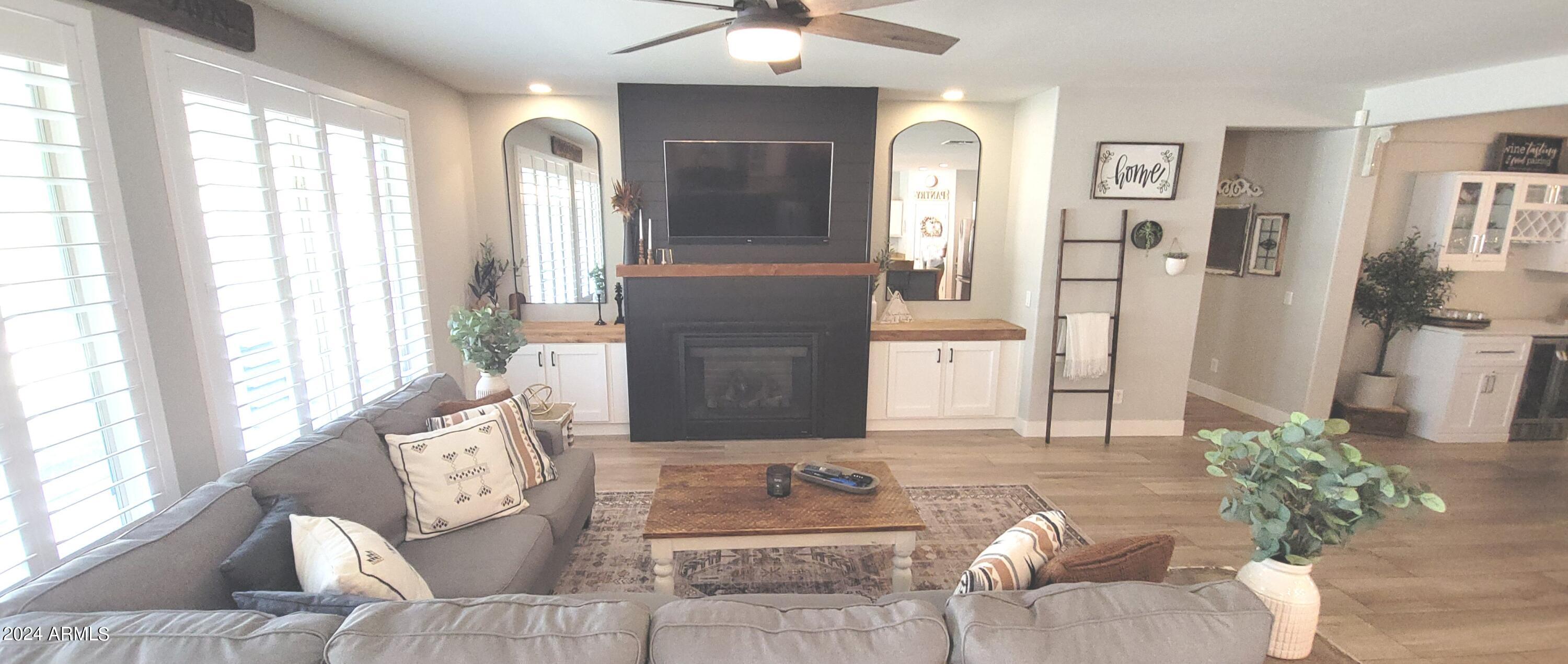 3236 East Phelps Street Gilbert, AZ 85295 - Photo 16 of 50 a living room with furniture and a large window