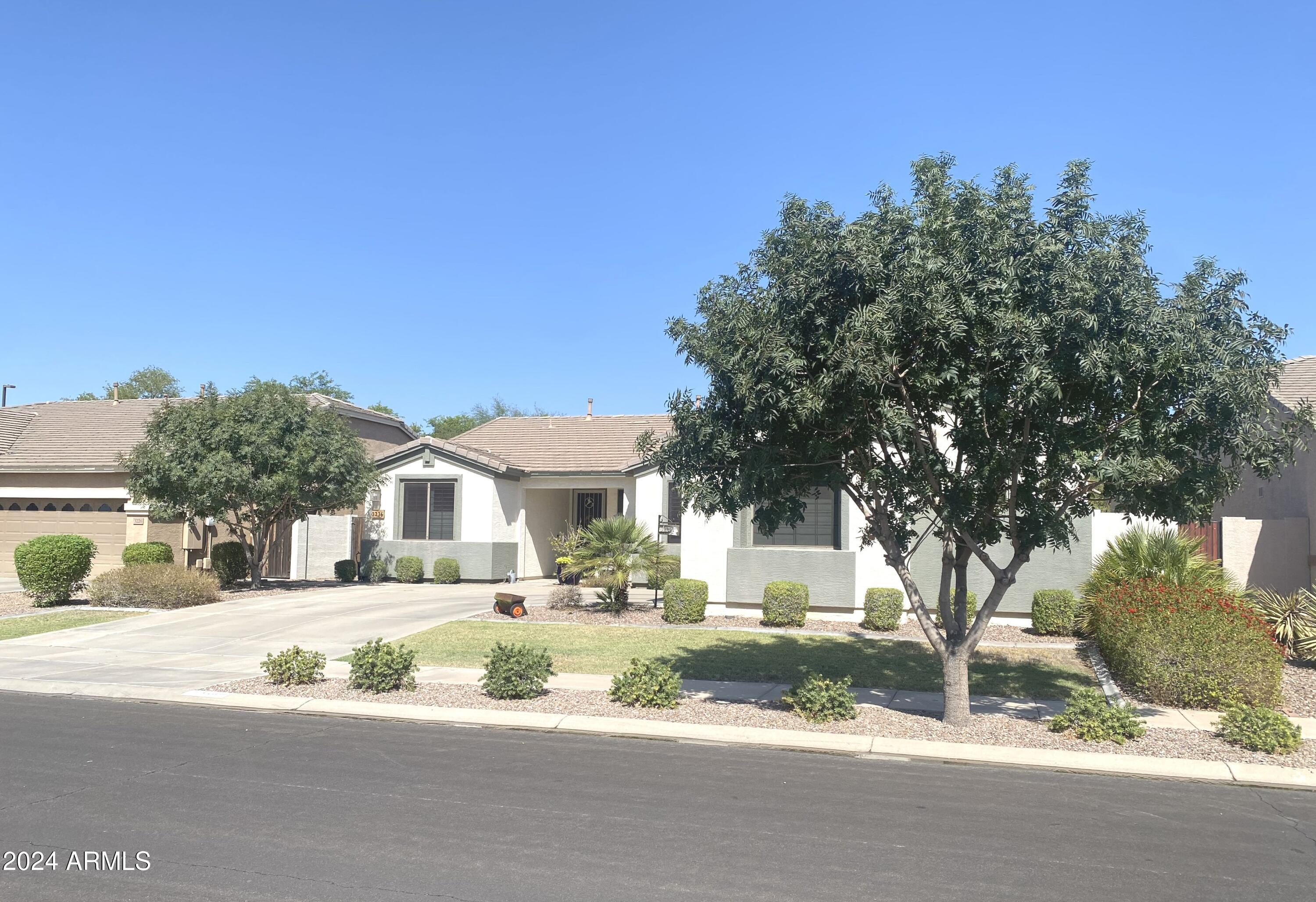 3236 East Phelps Street Gilbert, AZ 85295 - Photo 2 of 50 a front view of a house with a yard
