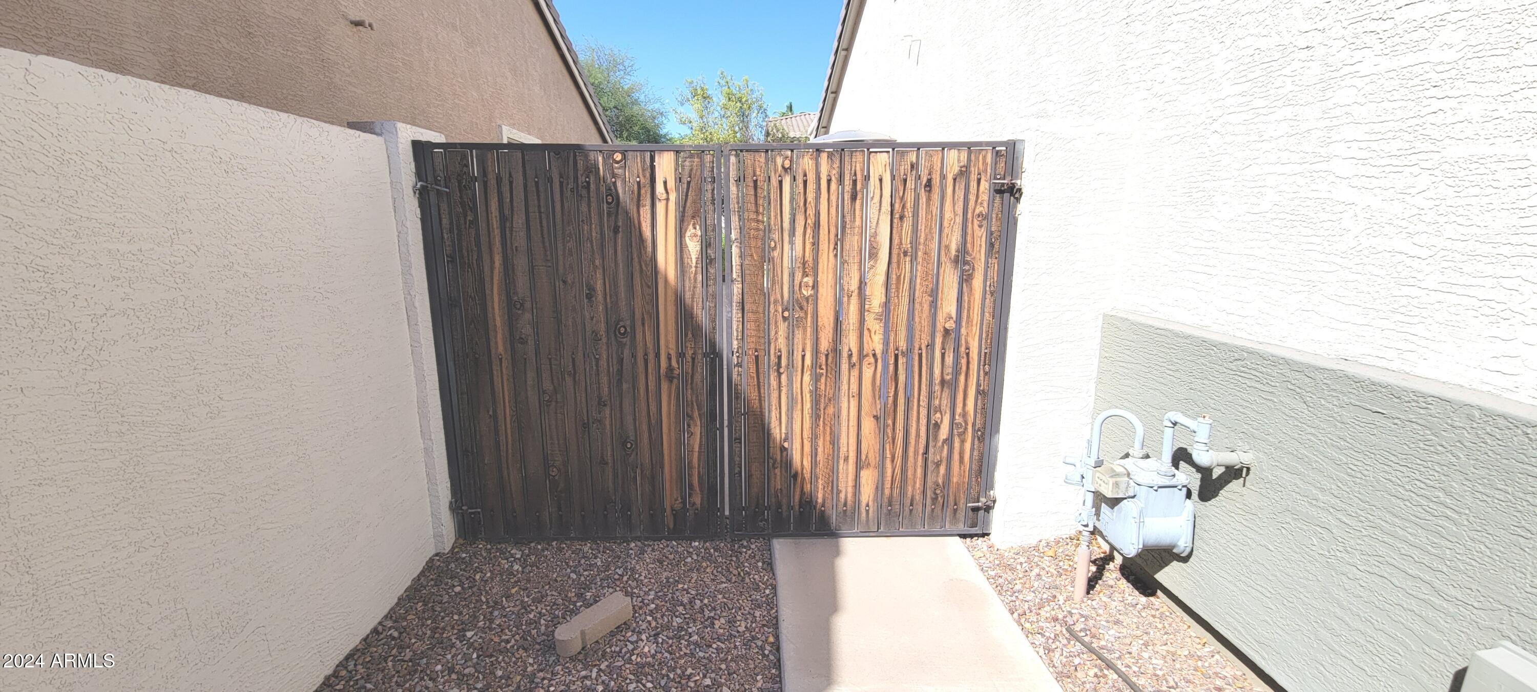 3236 East Phelps Street Gilbert, AZ 85295 - Photo 41 of 50 a view of entryway with wooden floor