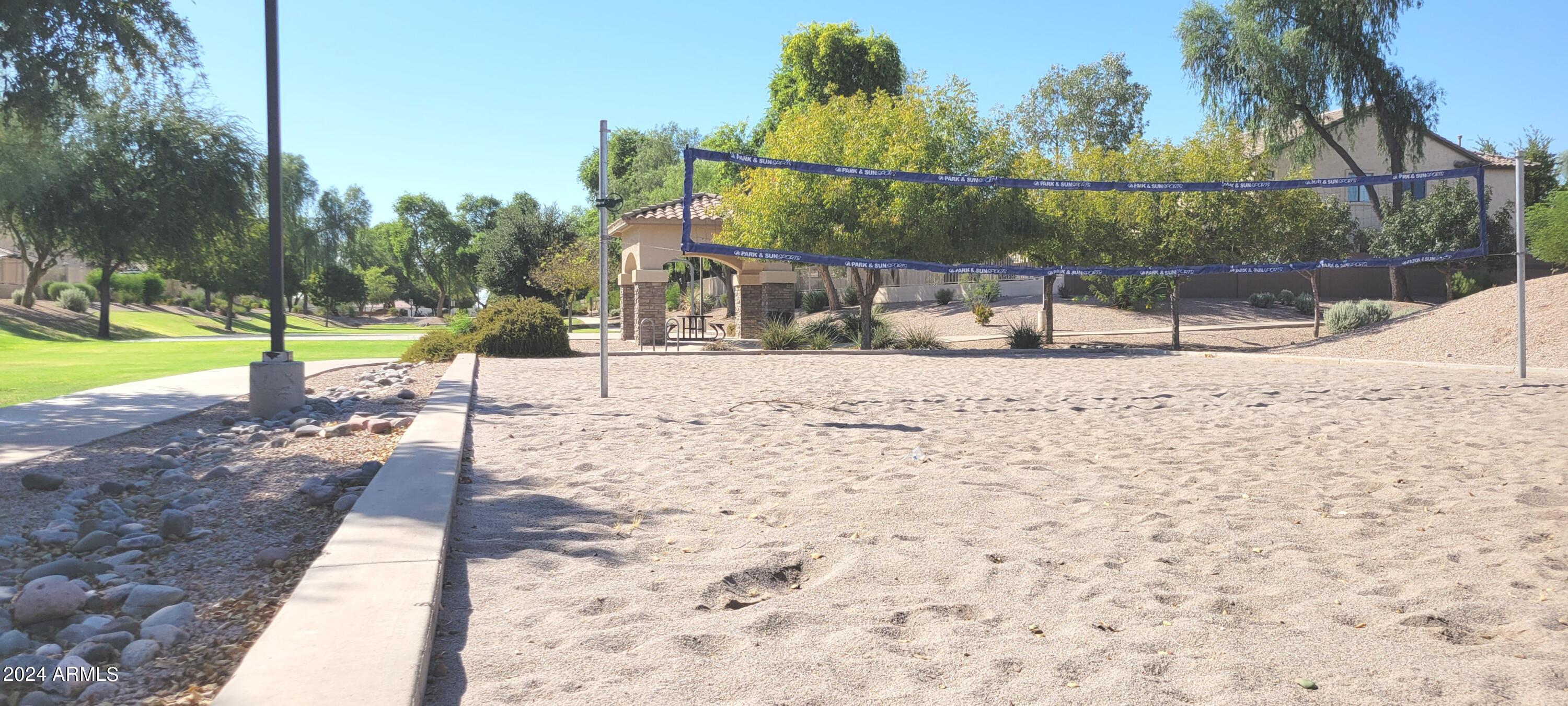 3236 East Phelps Street Gilbert, AZ 85295 - Photo 48 of 50 a view of a yard with a house in the background