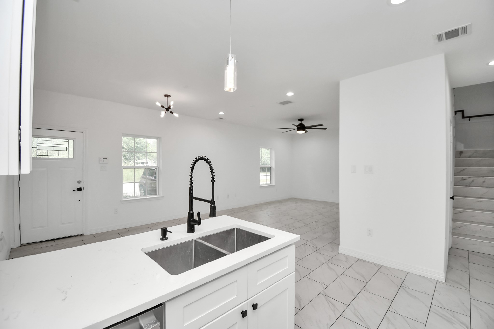 9003 Prairie View Drive, Unit B Houston, TX 77088 - Photo 12 of 20 a kitchen with a sink and cabinets
