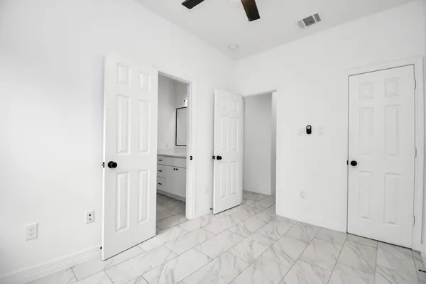 a view of a hallway with closet area