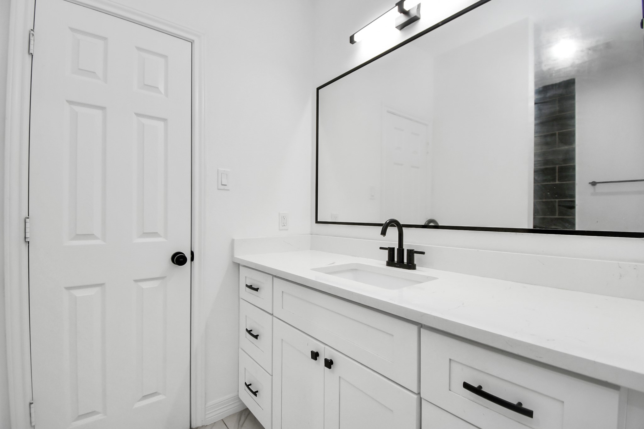9003 Prairie View Drive, Unit B Houston, TX 77088 - Photo 17 of 20 a bathroom with a sink and a mirror