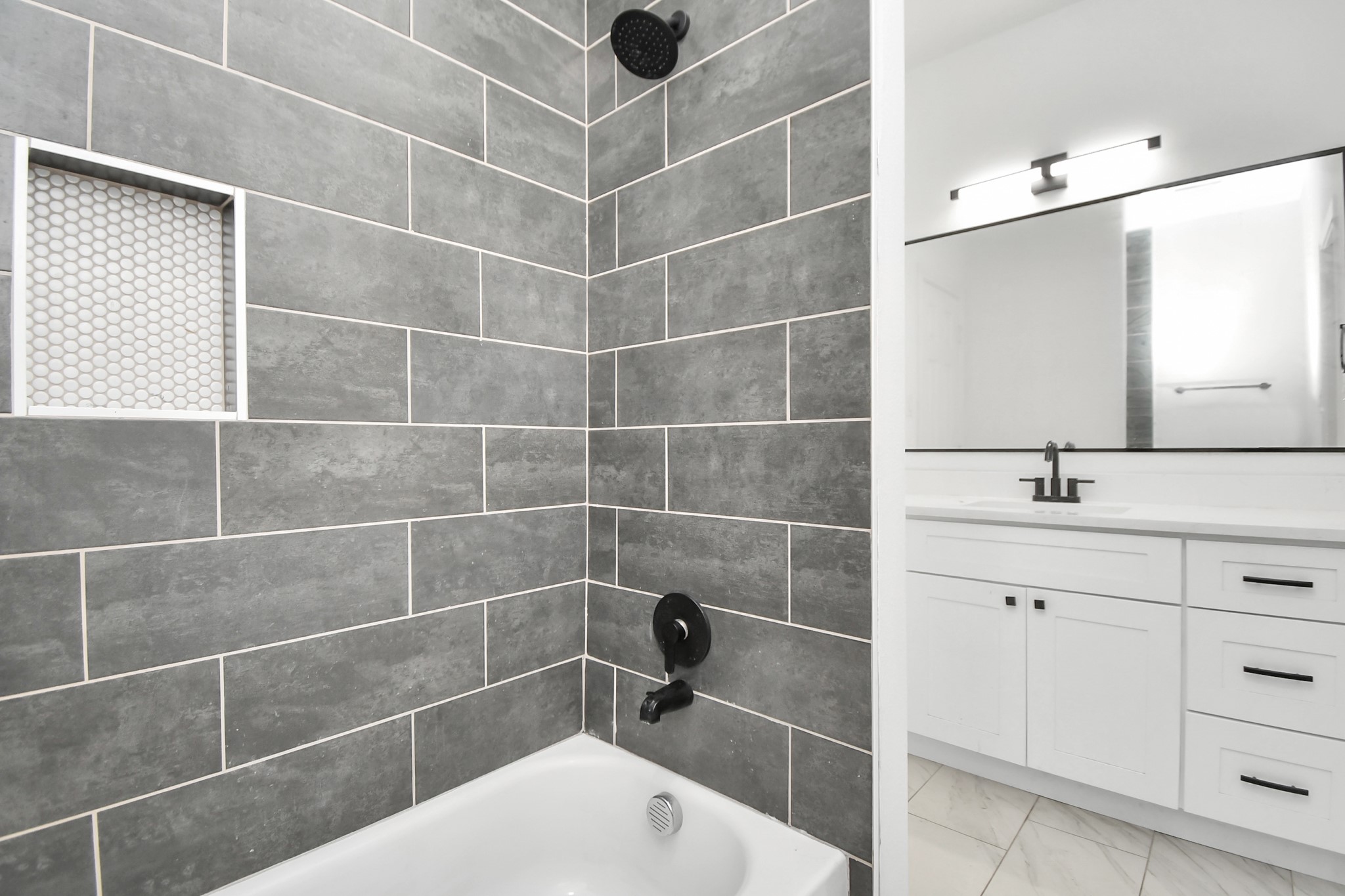 9003 Prairie View Drive, Unit B Houston, TX 77088 - Photo 18 of 20 a bathroom with a sink a toilet and shower