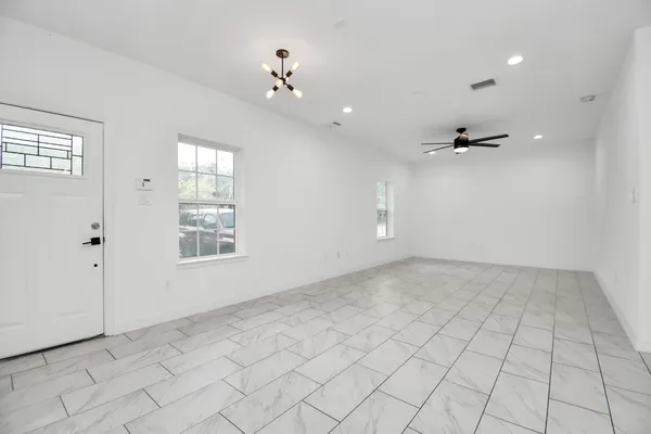 a view of an empty room with a window