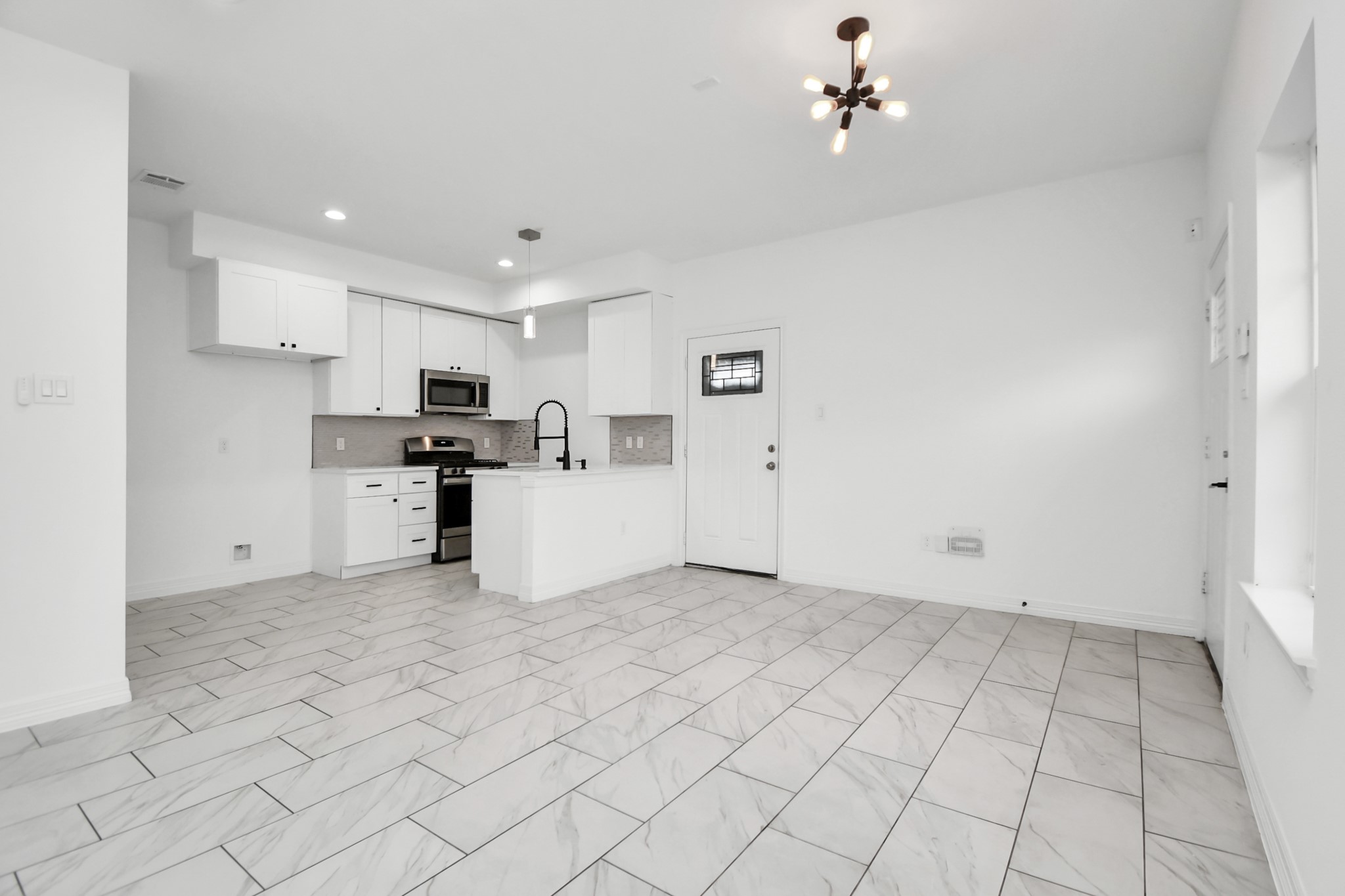 9003 Prairie View Drive, Unit B Houston, TX 77088 - Photo 9 of 20 a view of a kitchen with electric appliances