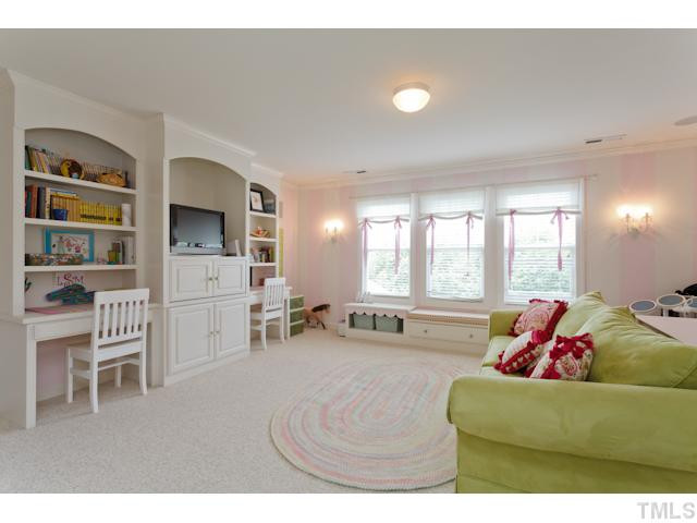 4004 Fenn Brook Lane Raleigh, NC 27613 - Photo 15 of 25 Beautiful Bonus Room with built in shelves and desk areas. Beautiful detail and lots of natural light. Bonus Room