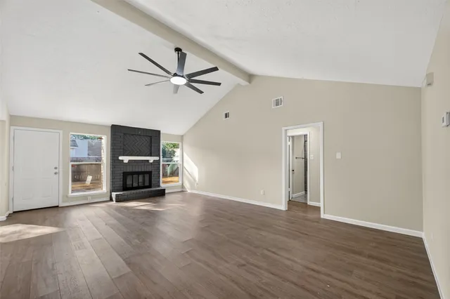 a view of a livingroom with a flat screen tv and a fireplace