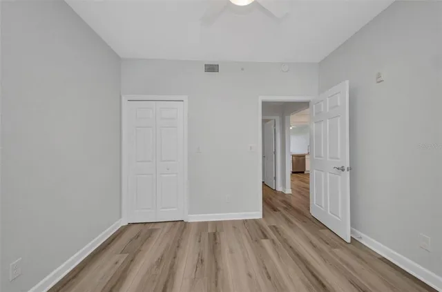 a view of a room with wooden floor