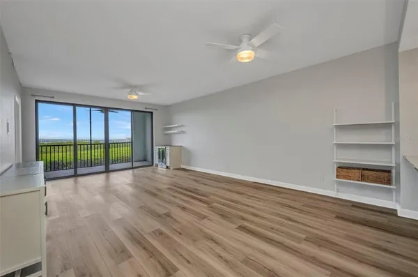 a view of wooden floor in an empty room