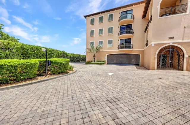 a view of a backyard with plants and a patio