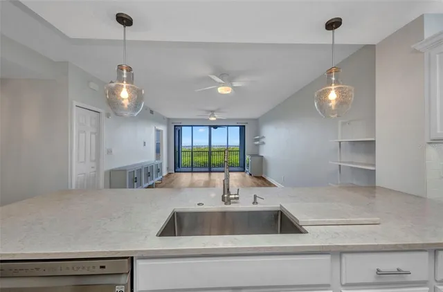 a kitchen with a refrigerator and a sink