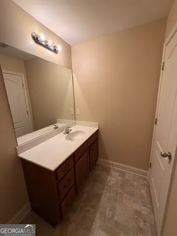 a bathroom with a toilet a sink and shower