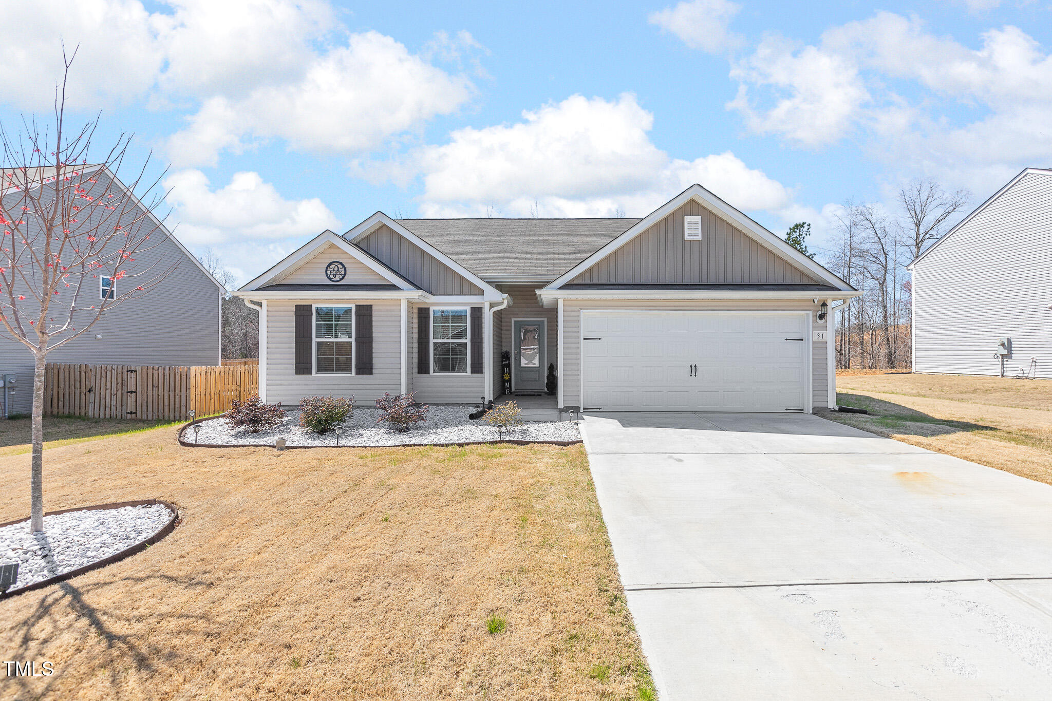 a view of a house with a yard and garage
