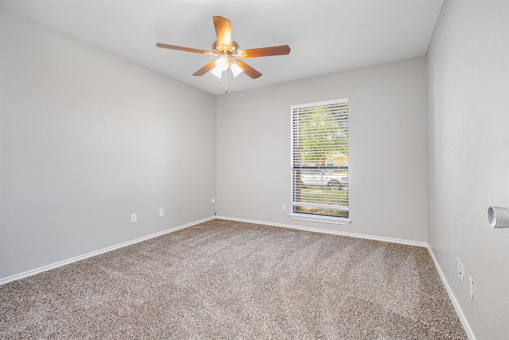 5633 Trego Street The Colony, TX 75056 - Photo 20 of 22 an empty room with a window