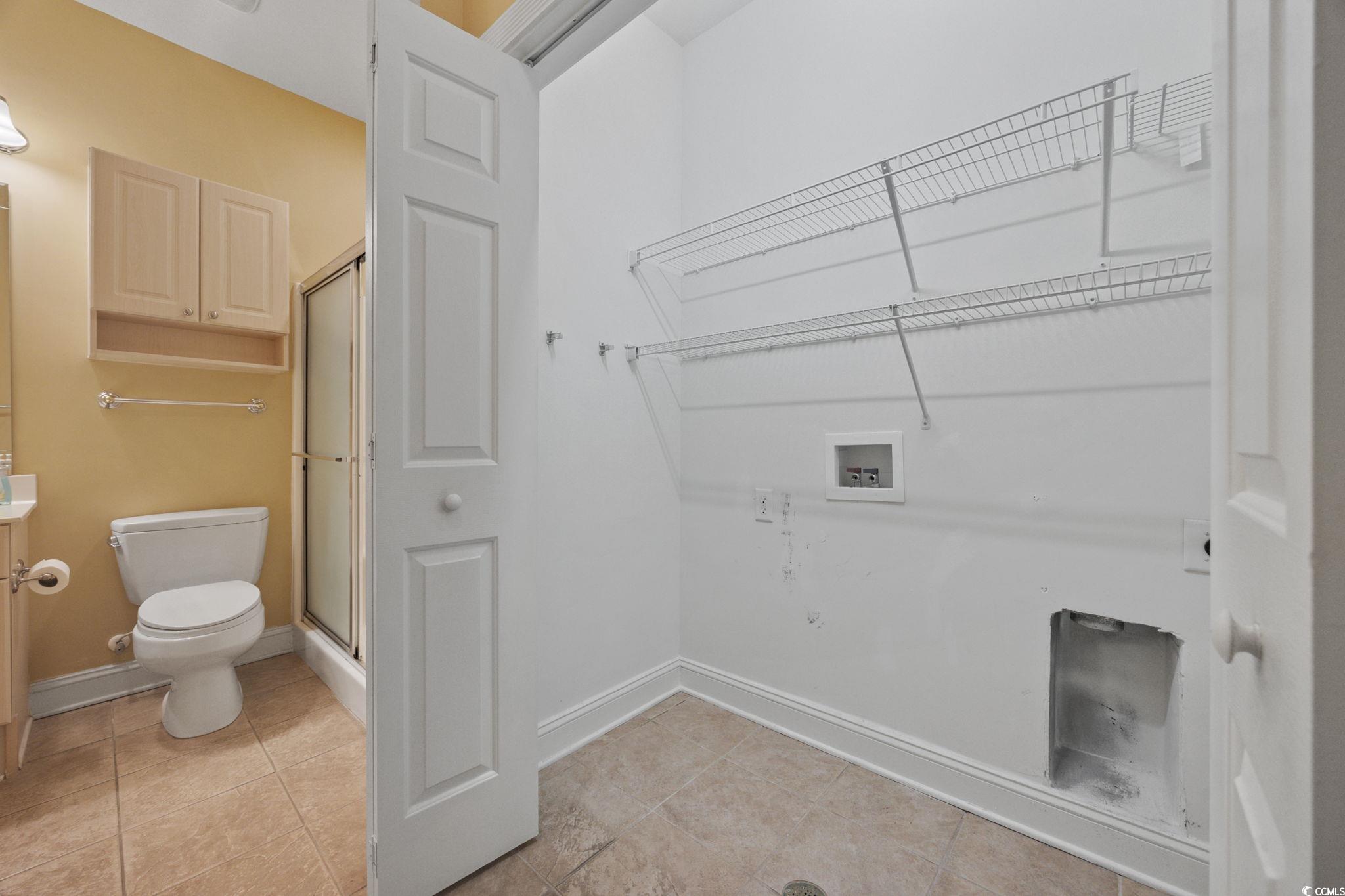 4847 Luster Leaf Circle, Unit 403 Myrtle Beach, SC 29577 - Photo 24 of 37 Washroom featuring washer hookup and light tile patterned floors