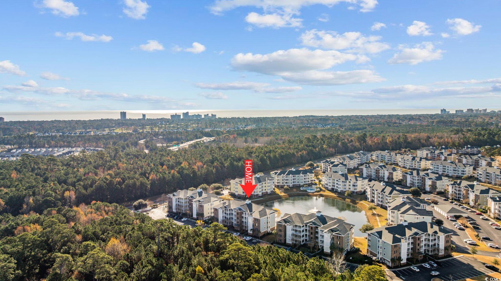 4847 Luster Leaf Circle, Unit 403 Myrtle Beach, SC 29577 - Photo 30 of 37 Aerial overview of property's location with a nearby body of water and nearby urban area