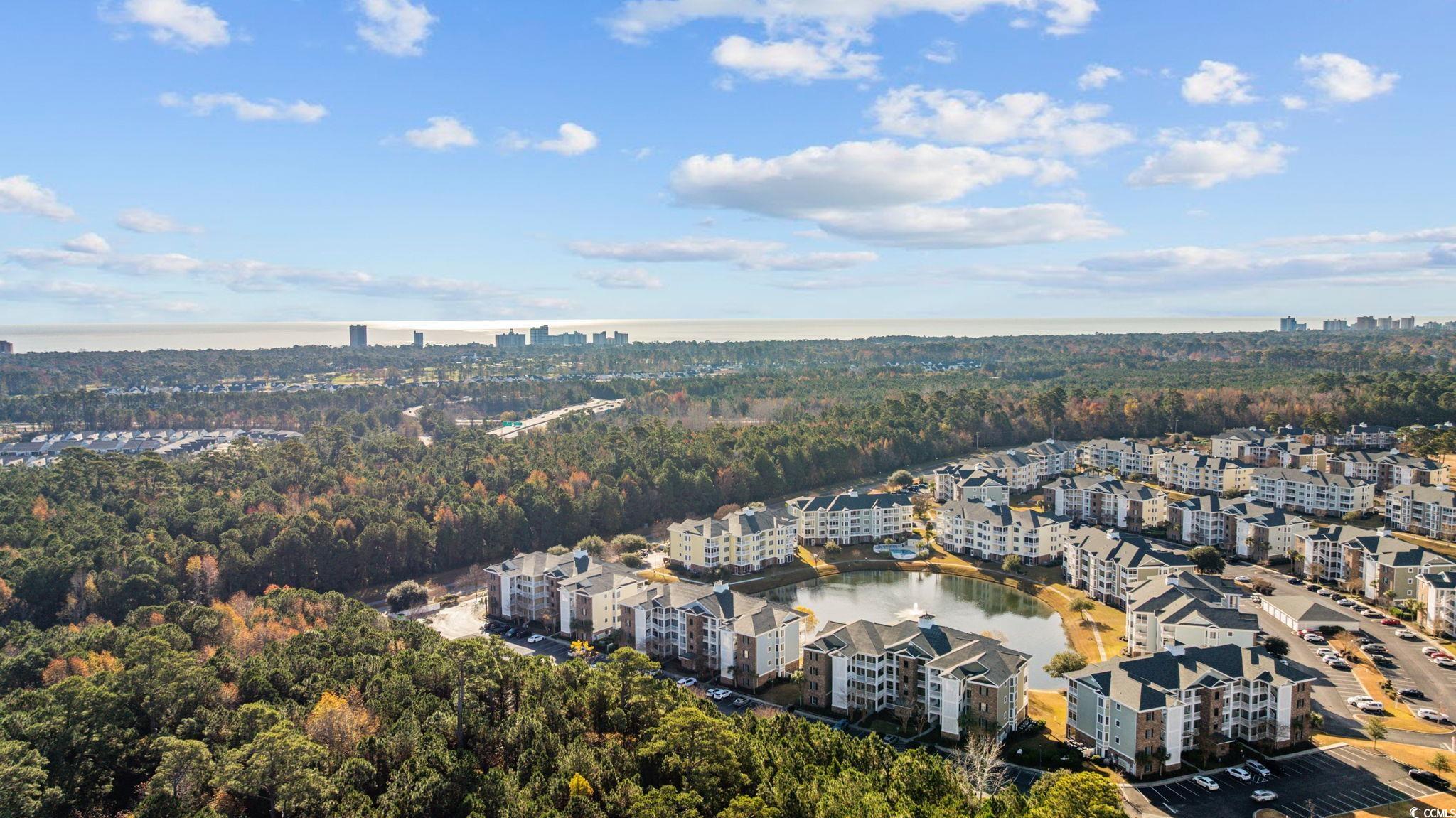 4847 Luster Leaf Circle, Unit 403 Myrtle Beach, SC 29577 - Photo 31 of 37 Aerial overview of property's location featuring a large body of water and nearby urban area