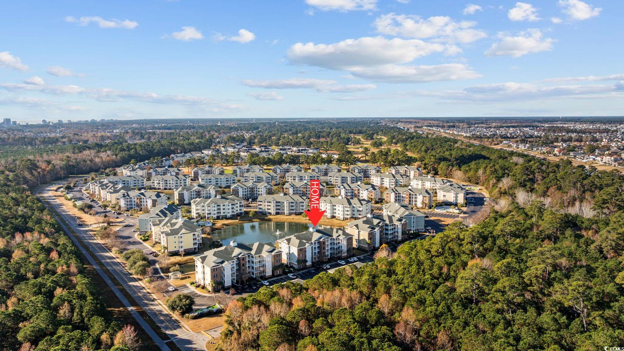 4847 Luster Leaf Circle, Unit 403 Myrtle Beach, SC 29577 - Photo 32 of 37 View of property location featuring apartment complex / building and a tree filled landscape