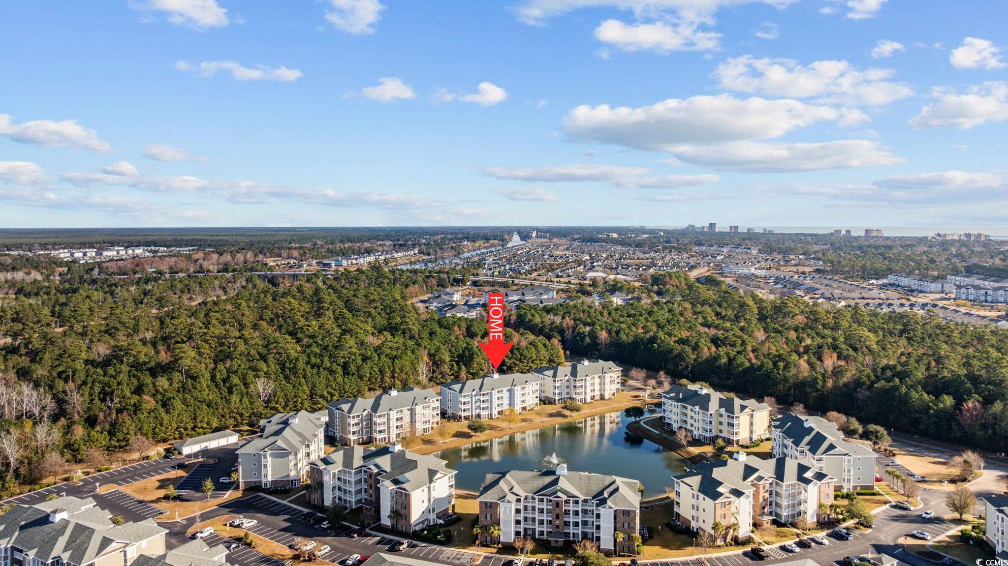 4847 Luster Leaf Circle, Unit 403 Myrtle Beach, SC 29577 - Photo 36 of 37 Aerial view of property's location with apartment complex / building and a large body of water
