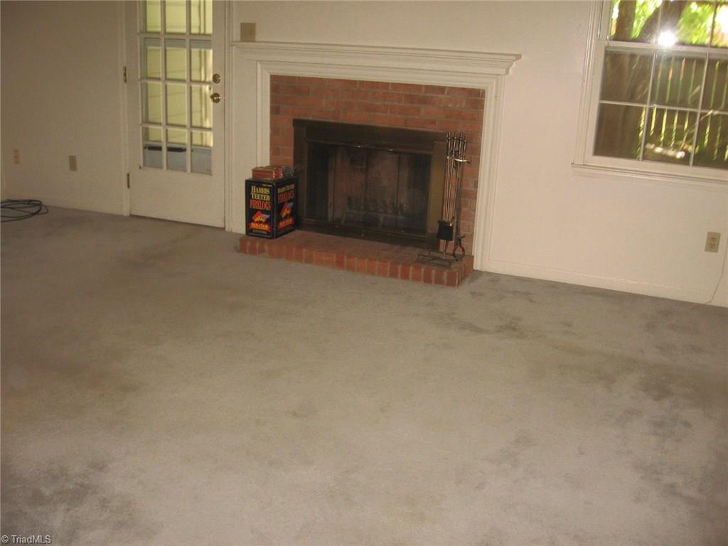 4923 Tower Road Greensboro, NC 27410 - Photo 4 of 11 living room with fireplace