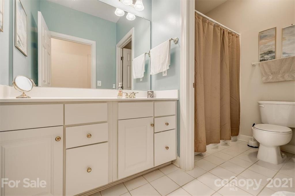 152 Melbourne Drive Fort Mill, SC 29708 - Photo 23 of 32 a bathroom with a toilet sink and mirror