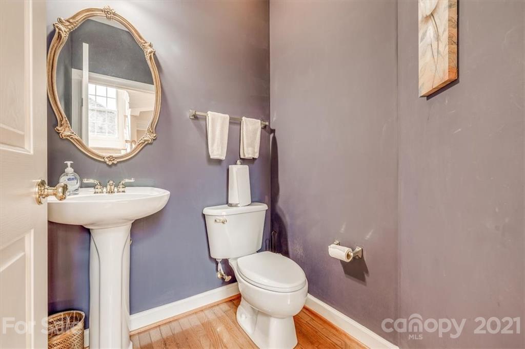 152 Melbourne Drive Fort Mill, SC 29708 - Photo 6 of 32 a bathroom with a toilet sink and mirror