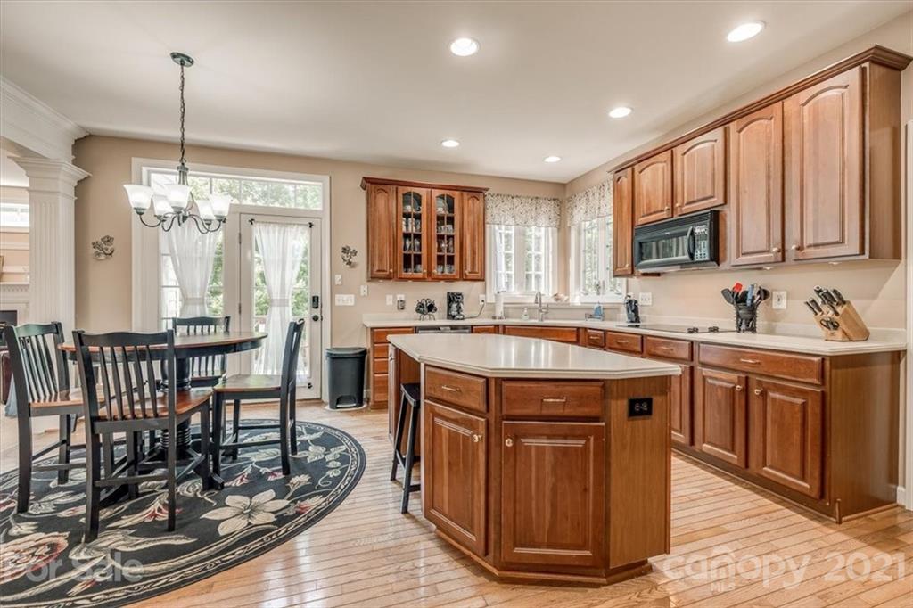 152 Melbourne Drive Fort Mill, SC 29708 - Photo 10 of 32 a kitchen with sink dining table and chairs