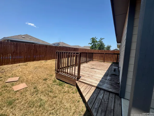 a view of balcony with wooden floor
